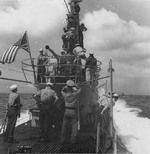 Sailors on and around the conning tower aboard USS Spot, 1944-1945
