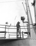 Raising the Chilean commission pennant on submarine Simpson, 21 Jan 1962