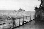 Cruiser Takao underway, en route to the Guadalcanal area in the Solomon Islands, 14 Nov 1942; photo taken from cruiser Atago, part of which could be seen in foreground