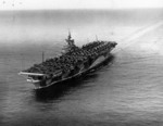 Carrier Ticonderoga off San Diego, California, United States, 16 Sep 1944; note extra aircraft loaded on deck destined for Hawaii, and camouflage pattern Measure 33 Design 10a. Photo 1 of 2.