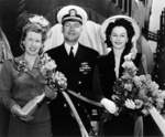 Commander Roy Davenport with his wife (with bottle) and Mrs. Garvey at the christening of submarine Trepang, Mare Island Naval Shipyard, California, United States, 23 Mar 1944