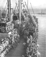 Returning Japanese-American troops lining up at the rails of Victory Ship SS Waterbury Victory, Honolulu, US Territory of Hawaii, 9 Aug 1946