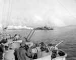 USS Cony laying smoke screen near USS West Virginia, off Leyte