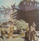 US Army CCKW 2 1/2-ton 6x6 cargo truck with Browning M2 machine gun preparing to be loaded aboard an LST prior to the Normandy invasion, southern England, Jun 1944, photo 2 of 2