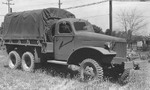 Front view of an International Harvester M-5H-6 2 1/2-ton 6x6 transport truck with 12-ft. bed, built to the same specifications as the GMC CCKW but in much fewer numbers; Holabird, Mayland, United States, date unknown