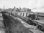 Cruiser Mk V Covenanter III tanks of British 9th Armoured Division being loaded onto flatbed railway wagons, Blaydon near Newcastle, England, United Kingdom, 17 Oct 1941