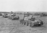 Prime Minister Winston Churchill and Major-General Brian Horrocks aboard a Covenanter tank of 4th/7th Royal Dragoon Guards, British 27th Armoured Brigade near Newmarket, Suffolk, England, United Kingdom, 16 May 1942; note H. V. Evatt in second tank