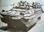 US Army DUKW landing on a beach with troops, date unknown; note M1 Garand rifles