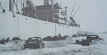 DUKWs awaiting supplies from a Victory Ship, 1944-1945