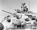 A Humber Mk II armoured car of 4th Light Armoured Brigade on patrol in the Western Desert, Egypt, 10 Aug 1942