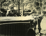 Japanese-American sergeant of US 442nd Regimental Combat Team delivering mail to a Jeep driver, date unknown