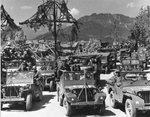 US Army vehicles on the road leading to the Eagle