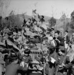 Chinese children celebrating on top of a Jeep, circa 1945; the occasion was either the opening of Ledo Road or victory over Japan