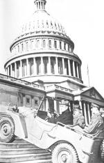 US Senators Meade and Thomas riding a Willys Quad as it climbed steps in front of the US Congress building, Washington, DC, United States, seen on 20 Feb 1941 issue of newspaper Washington Daily News