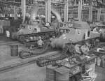 Workers putting tracks onto a M3 tank at the Detroit Arsenal Tank Plant, Warren, Michigan, United States, circa 1940-1942, photo 2 of 2