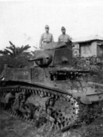 Two Japanese soldiers posing with a captured American M3 light tank, near Manila, Philippine Islands, Jan 1942