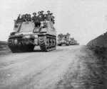 A column of Kangaroo armored personnel carrier converted from M7 Priest self-propelled artillery vehicles, France, 7 Aug 1944