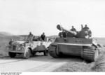 German Tiger I heavy tank and another vehicle on a road in Tunisia, 26 Feb 1943