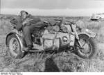 Soldier of German 24th Panzer Division sleeping on the sidecar of a R75 motorcycle, southern Russia, Aug-Sep 1942