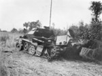 A wrecked German SdKfz. 251 halftrack vehicle in Northern France, victim of USAAF 9th Air Force fighters, 26 Jul 1944