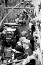 German General Heinz Guderian in a SdKfz. 251/3 halftrack vehicle, France, May 1940, photo 3 of 6; note early 3-rotor Enigma machine