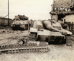 Wrecked US M4 Sherman tank and German StuG III assault gun, 1944-1945