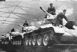 Newly built T-34 tanks being prepared for rail transport to Eastern Europe, Uralmash production facility, Sverdlovsk, Russia, 1 Feb 1942