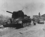 Destroyed T-34 tank on a road toward Gimpo Airfield, Korea, 17 Sep 1950
