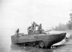 Japanese Type 2 Ka-Mi amphibious tank coming ashore after trials carried out by members of Australian 2/4 Armoured Regiment in Talili Bay, Rabaul, New Britain, Solomon Islands, 20 Nov 1945