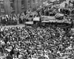 Crowd of British factory workers checking out the Valentine tank named 