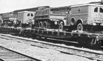 Dodge WC27 1/2 ton ambulances and CCKW 21/2 ton trucks loaded on railway flat cars for shipment from manufacturing plants to points of embarkation, circa 1941