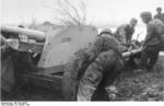 German paratroopers moving a 7.5 cm PaK 40 gun into position in muddy terrain, Italy, 23 Feb 1945