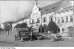German Opel Blitz, a tracked vehicle, and a towed 7.5 cm PaK 40 gun in a Hungarian town during the German retreat from Romania, Aug 1944