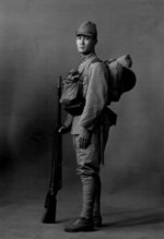 Portrait of a Japanese Army soldier with Type 38 rifle and other gear, date unknown