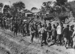 Japanese soldiers escorting a column of Chinese prisoners of war, China, circa late 1937 to early 1938