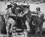 155 mm Howitzer Carriage M1917 or M1918 howitzer and crew in exercise, Camp Carson, Colorado, United States, 24 Apr 1943, photo 2 of 2