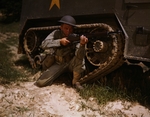 US Army soldier posing with his M1 Garand rifle next to a M3 halftrack, Fort Knox, Kentucky, United States, Jun 1942, photo 1 of 4