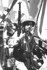 Sergeant Carrol Williford of US 3rd Marine Division in a ruined chapel with his M1 Garand rifle near the Asan beachhead, Guam, Mariana Islands, 3 Aug 1944