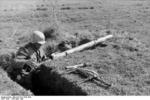 German troops with Panzerschreck anti-tank weapon, Italy, Apr-May 1944; note MP 40 submachine gun and Model 24 grenade nearby