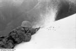 German soldier firing a MP 40 submachine gun in snowy terrain, Italy, winter of 1943-1944
