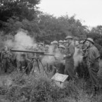 British War Office personnel instructing Home Guard personnel on the use of a Northover Projector in Saxmundham, Suffolk, England, United Kingdom, 30 Jul 1941