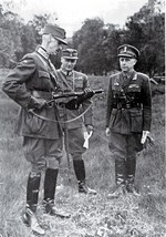 King Haakon VII of Norway inspecting a Sten gun with Crown Prince Olav in Britain, 1940s