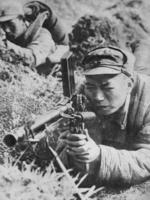 Chinese soldier of the Japanese-sponsored Nanjing puppet government with a ZB vz. 26 light machine gun, China, date unknown