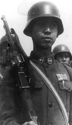 Chinese soldier with Czech-made ZB vz. 26 light machine gun and German-style helmet, date unknown