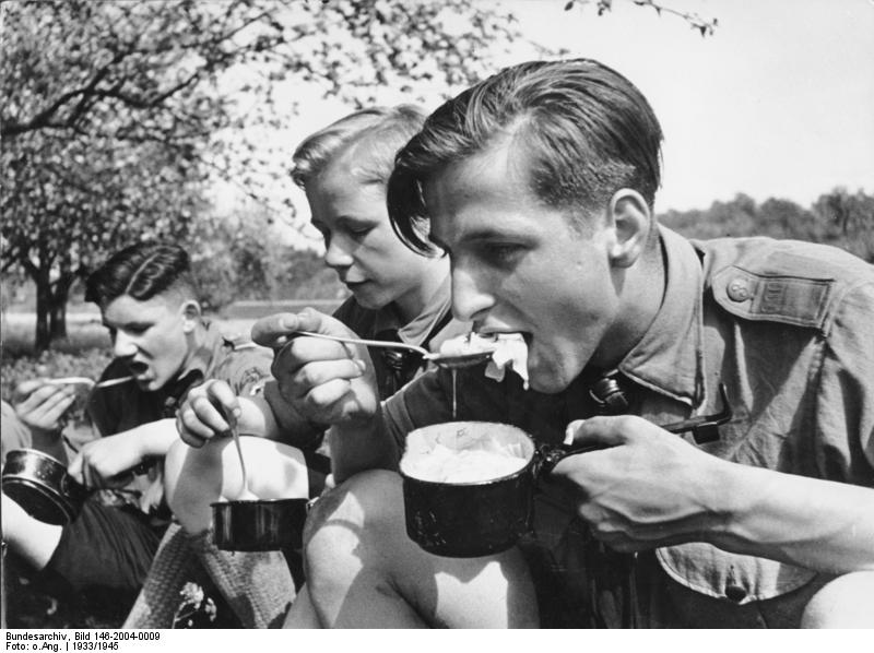 [Photo] Hitler Youth members eating a meal while on a field exercise ...