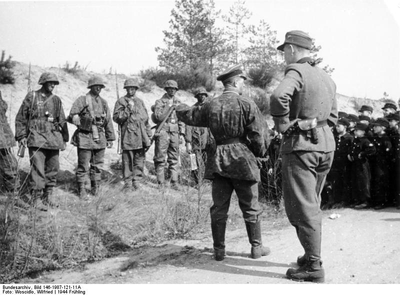 Hitler Youth members meeting soldiers of German 12th SS Panzer Division 'Hitlerjugend', Belgium, 21 Mar 1944