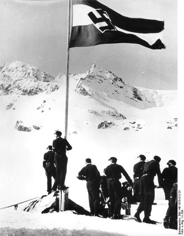 Hitler Youth members climbing a snowy mountain, date unknown