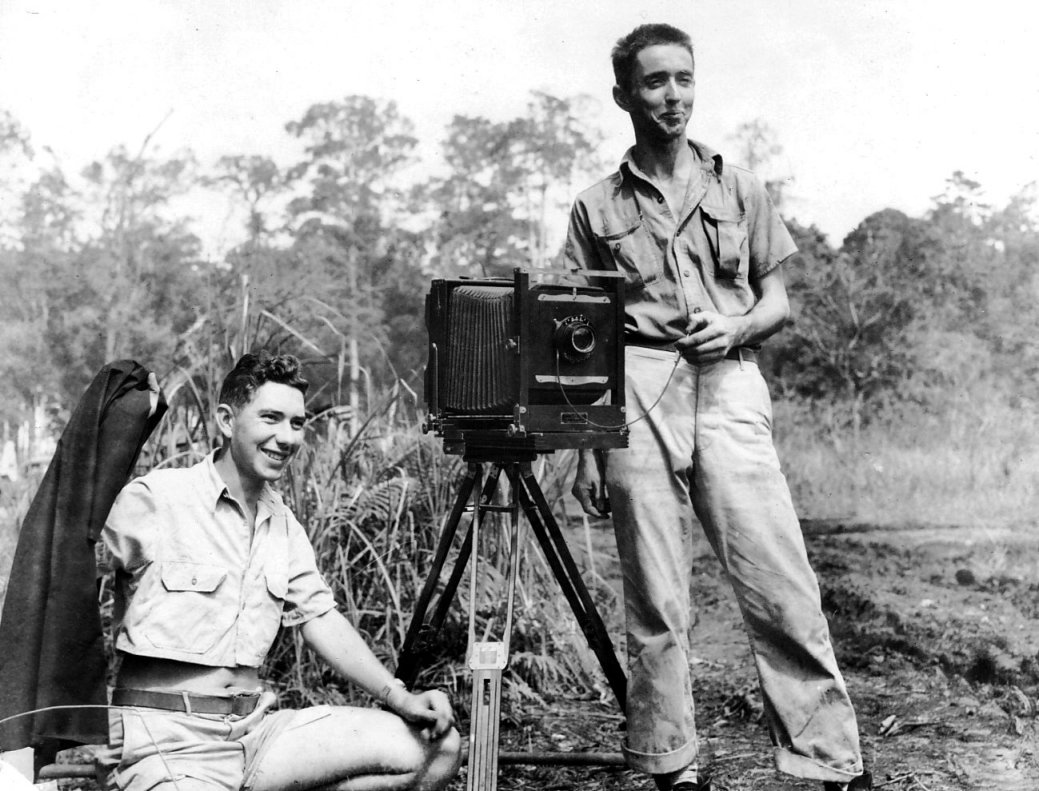 Photographers Jack Heyn (sitting) and Marvin Culbreth (standing) of USAAF 3rd Bomb Group, Dobodura Airfield, Australian Papua, mid-1943