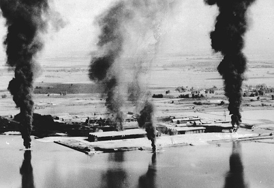 Seaplane hangars under US Navy carrier aircraft attack, Toko Bay (now Dapeng Bay), southern Taiwan, 12 Oct 1944, photo 3 of 7
