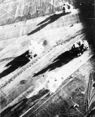 Carrier aircraft of Task Force 38 attacking the Japanese Army airfield at Takao (now Kaohsiung), Taiwan, 12 Oct 1944, photo 1 of 4; US intelligence referred to this field as 'Reigaryo Airfield'